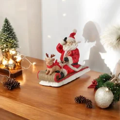 Resin Santa with Pig on Sled Figurine| Sale